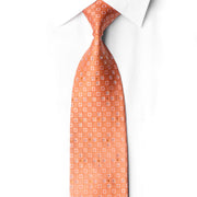 San-Dee coral peach rhinestone silk necktie worn on white dress shirt with classic knot showing square jacquard pattern