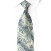 Front view of silver ivory paisley silk necktie with blue-gray flourishes and sparkling rhinestones