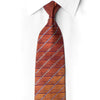 San-Dee men's 100% silk necktie in amber and burgundy diagonal stripes with hand-applied crystal rhinestone and silver sparkle accents, shown knotted on white dress shirt – front view