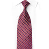 Burgundy silk necktie knotted beneath a white collar with copper diagonal lattice and crystal rhinestones