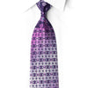 San-Dee purple silk necktie with floral and leaf motifs, jeweled crystal accents, and silver sparkle, shown rolled on white.