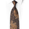 Front view of dark silk necktie with bronze-gold floral pattern and crystal rhinestone accents