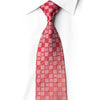 San-Dee ruby red silk necktie knotted on a white shirt, with champagne-toned checkerboard squares, crystal rhinestone clusters, and silver sparkles.