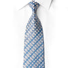 San-Dee men's 100% silk necktie in sky blue and white diamond check jacquard with diagonal rows of hand-applied teal crystal rhinestones and silver sparkle accents, knotted on white dress shirt – front close-up view