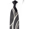 San-Dee black rhinestone silk necktie with silver wave stripe pattern and crystal rhinestones, worn on white dress shirt – front view