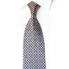 San-Dee navy blue and gold geometric checkerboard silk necktie with woven square motifs, worn on white dress shirt – front view