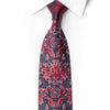 San-Dee RN657 red and navy floral rhinestone silk tie knotted against a white shirt, with dense crystal decoration on the blade.