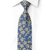 San-Dee navy blue and gold floral rhinestone silk necktie worn and knotted on white dress shirt collar